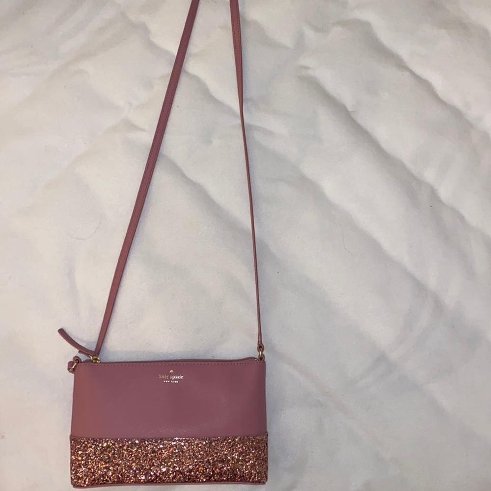Kate Spade small purse. Good quality and taken out once.